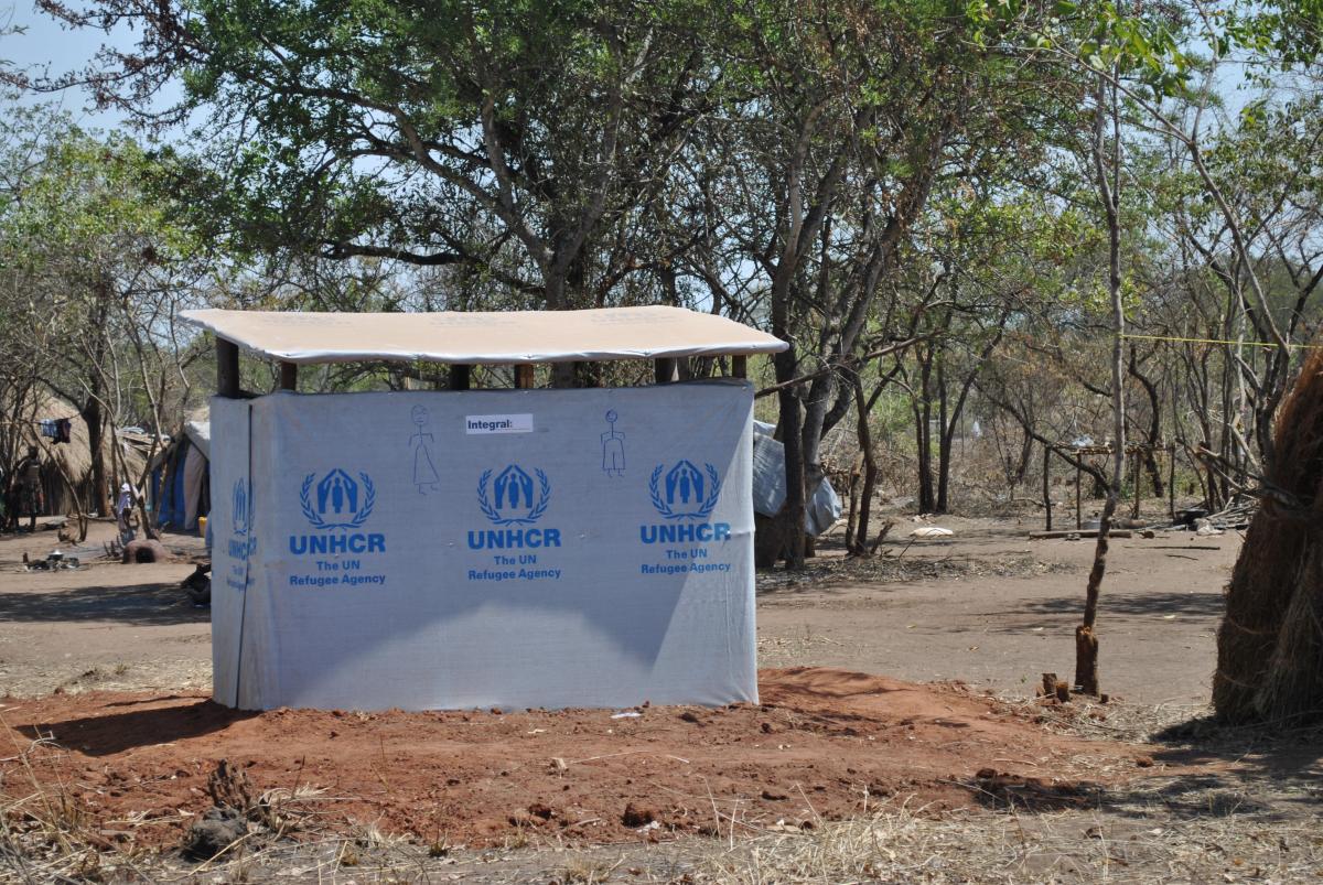 UNHCR tarps cover the latrines recently constructed by World Renew