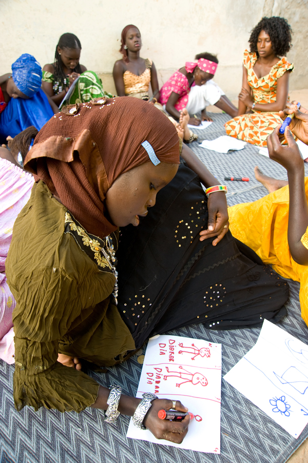 Girls from the community of Bene Barakh in Dakar use drawing as a way to express their dreams of their own futures through a session of the Embrace AIDS program. CRWRC has supported partner agency EELS (Eglise Évangélique Luthérienne du Sénégal) on health programming since 1998 as a way to reach young Senegalese, especially girls, with messages of health and awareness.