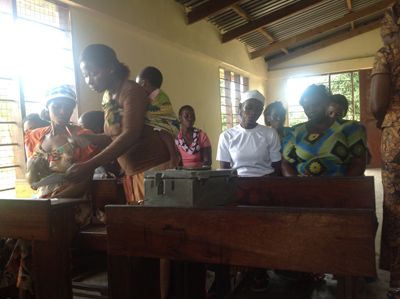 TOP: These women are the poorest members of the community. They started a Self-help Group to save money. They save .25 cents per week and their businesses are growing. ABOVE: These ladies meet every week to take out and pay back loans.The money is in circulation weekly in the village and the village economy is growing.