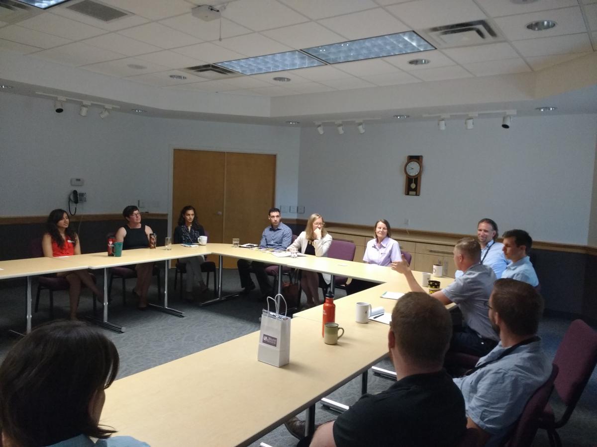 Karina Gould having a round table talk with World Renew staff.