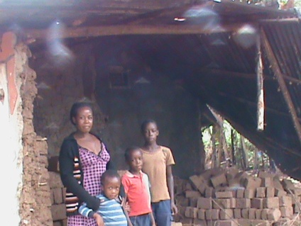 TOP: Justine and her three boys; ABOVE: Justine's crumbling house