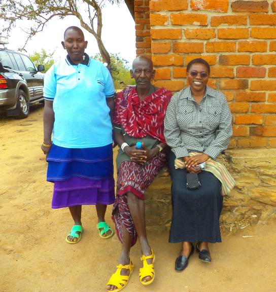 TOP: The community who are working together to create stable homes and families, ABOVE: Margaret with some of the participants