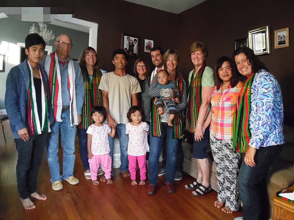 Grace CRC members with a refugee family from Myanmar.