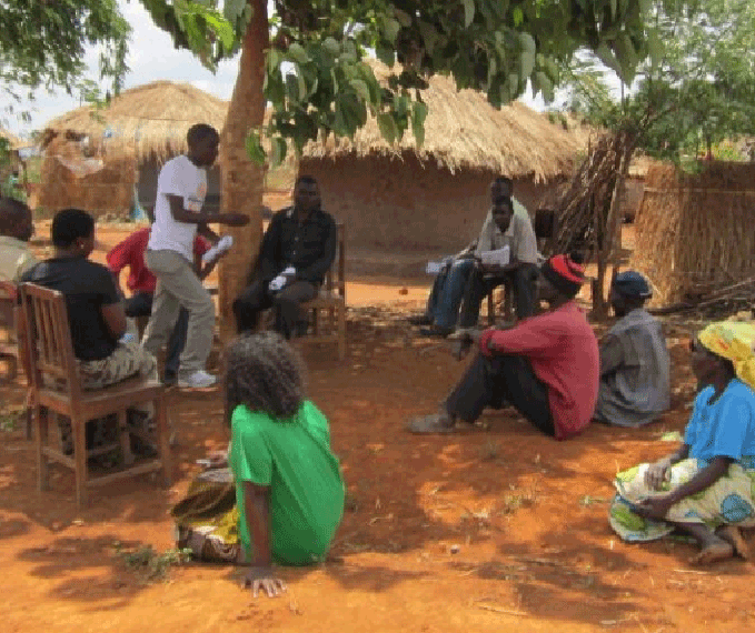 Top: Children in Nsucamiyala community Above: IRM Staff talk to a group of farmers at Guwa village after embarking on a mock survey exercise