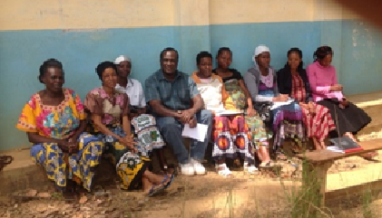 Davis, with a group of mothers, discussing their nutrition needs and the benefit of World Renew's training.