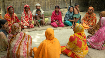 Latifa (top row, far left, in orange/red) joined a primary group in her Bangladesh community in 2001. Through the group she has learned literacy, poultry rearing, kitchen gardening, audit and accounts management, disaster risk management, and sewing. She has also grown in her confidence and ability to be a leader. She has successfully served as a leader of her primary group, and on the local central committee and people’s institution.