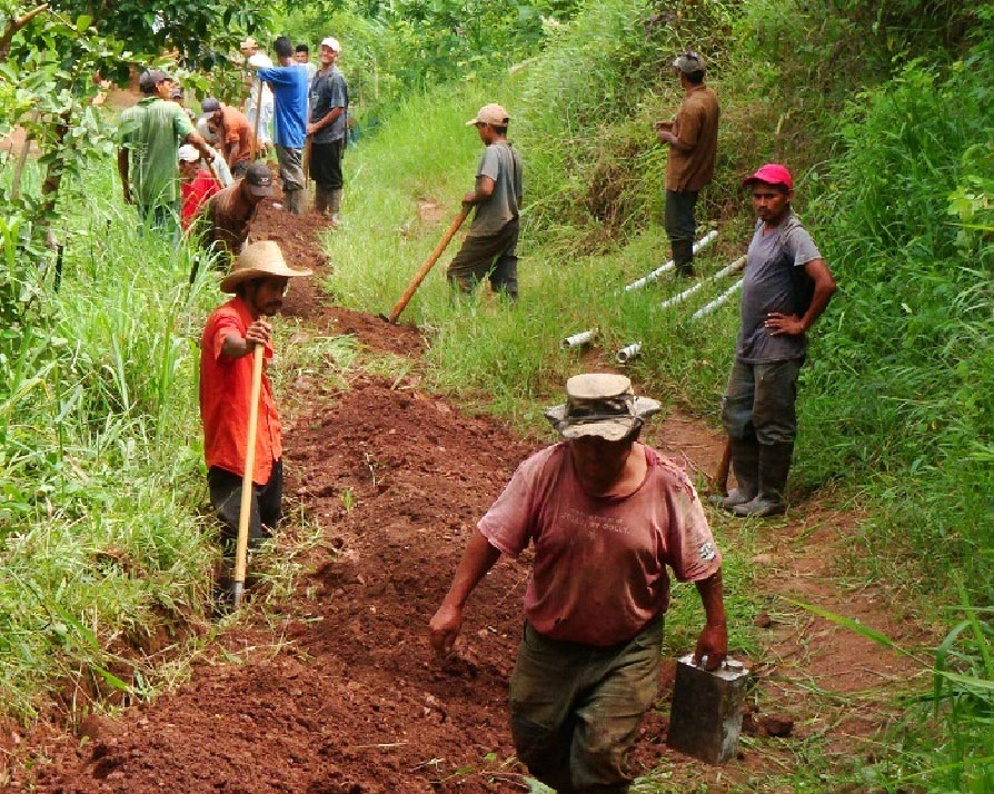 Top: Gracias Adios, Above: Students from Kings College & the community working on the holding tank