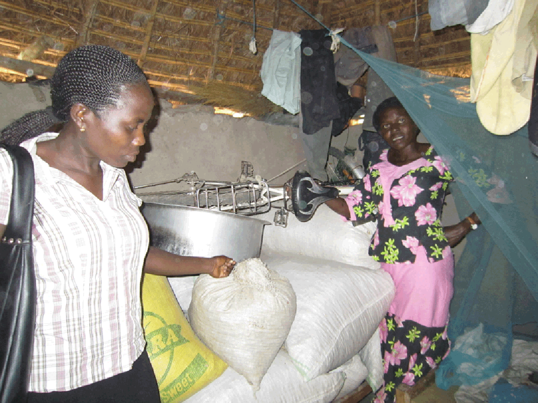 Top: The group, gathered near market for their weekly meeting, Above: Harriet & Lucy inside the house where she stores her food items