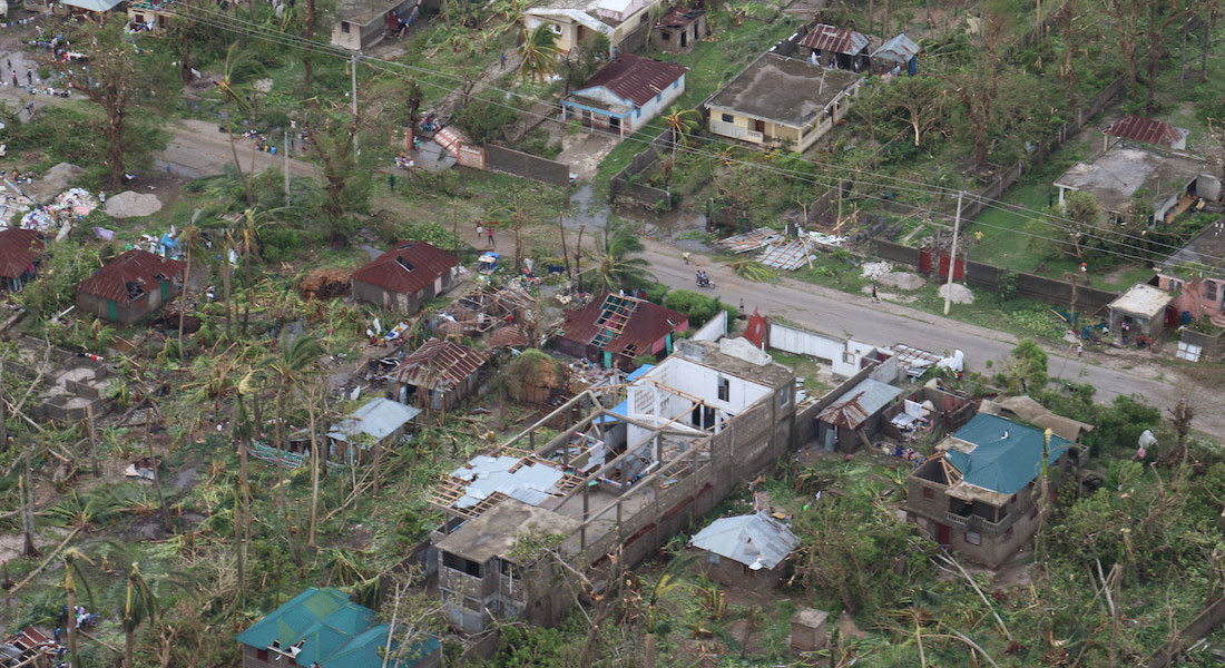 an aerials view of a street of homes devastated by natural disaster