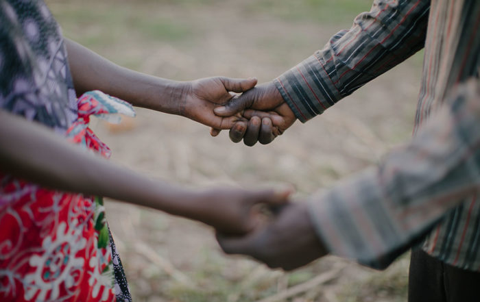 man and woman holding hands