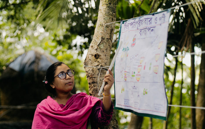 woman pointing at an infographic