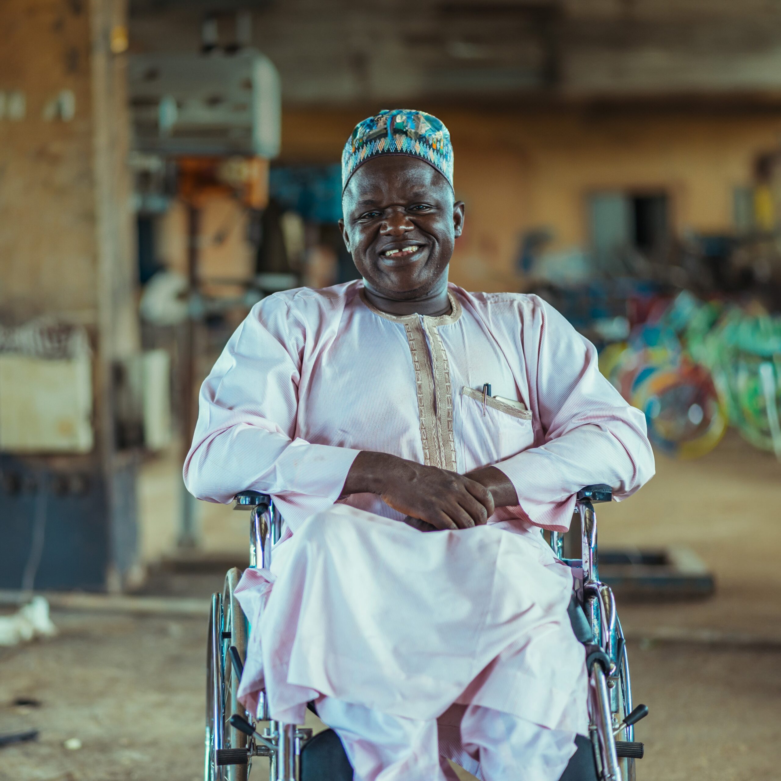 Nigerian man sitting in wheelchair
