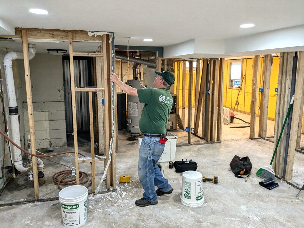 DRS volunteer working in IOWA repairing a flooded home