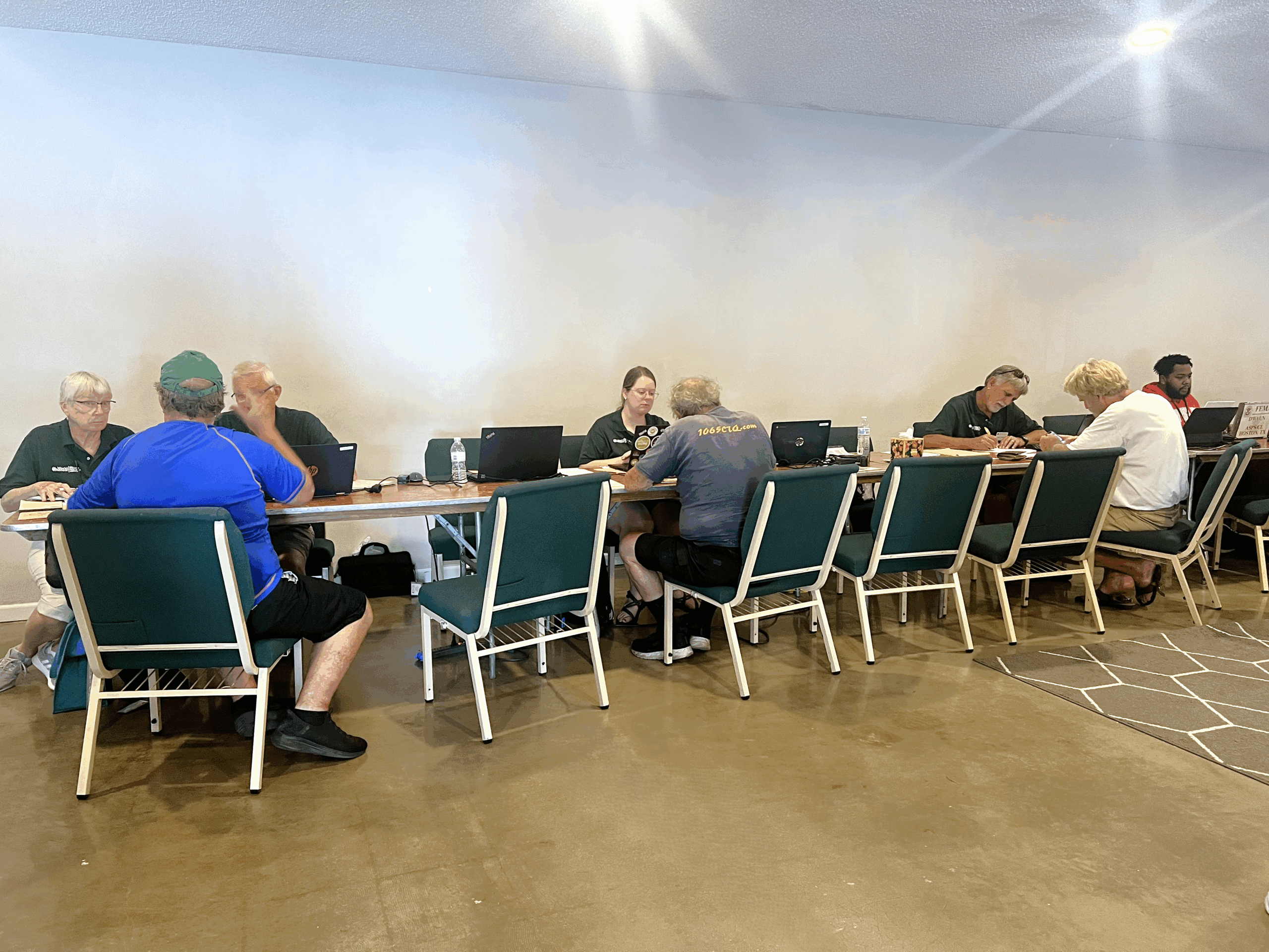 needs assessment volunteers meeting with disaster survivors
