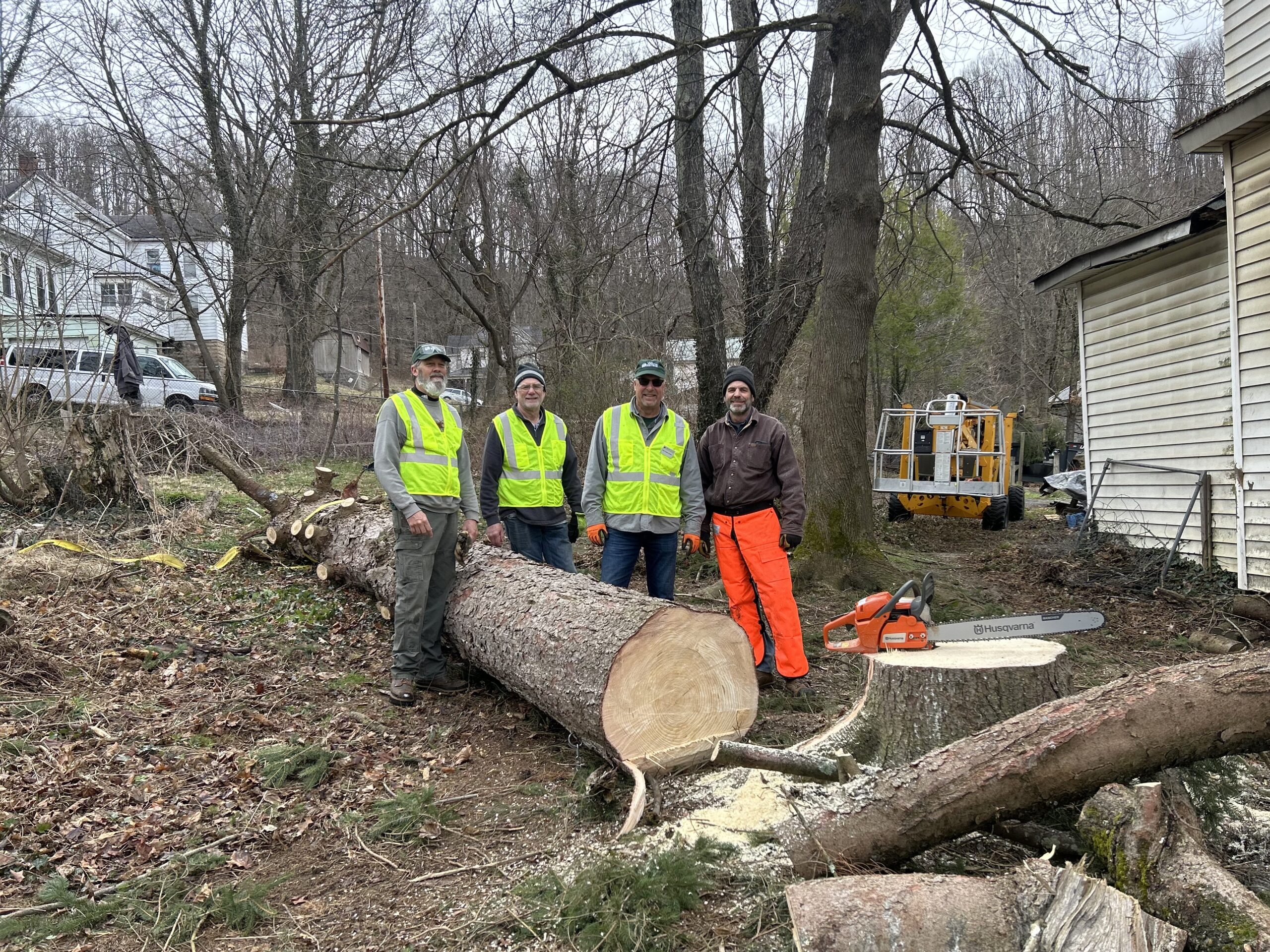 volunteer team removing downed trees from hurricane helene